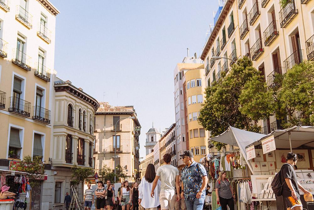 People shopping on The Calle de Toledo, a historic street in central Madrid, Spain.