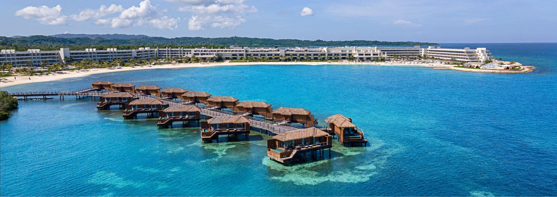 Overwater villas surrounded by turquoise Caribbean waters at Princess Hotels & Resorts Jamaica