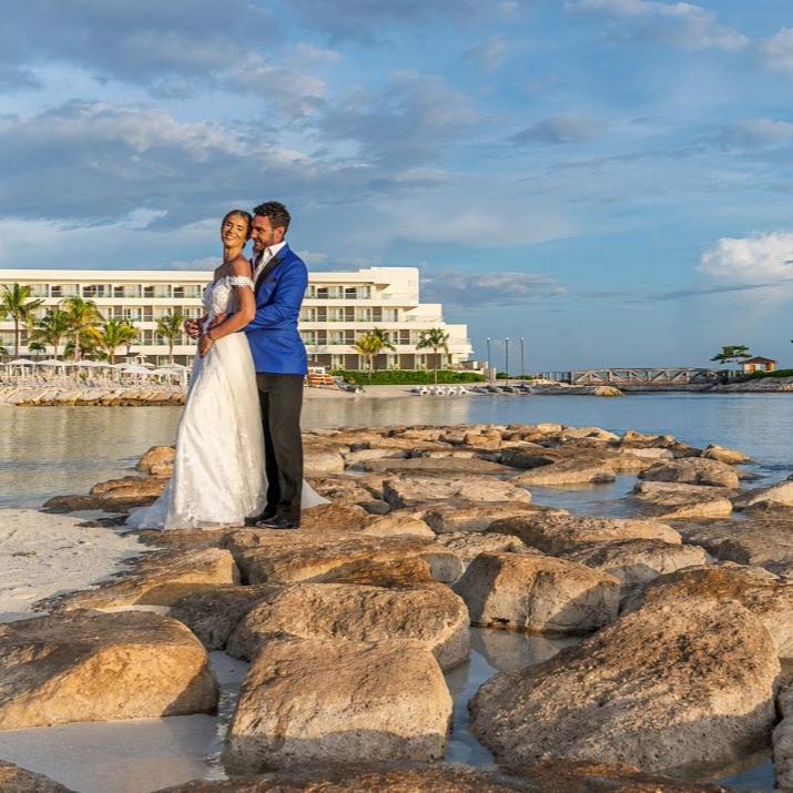 	Newlyweds embrace on the beach at Princess Hotels & Resorts Jamaica