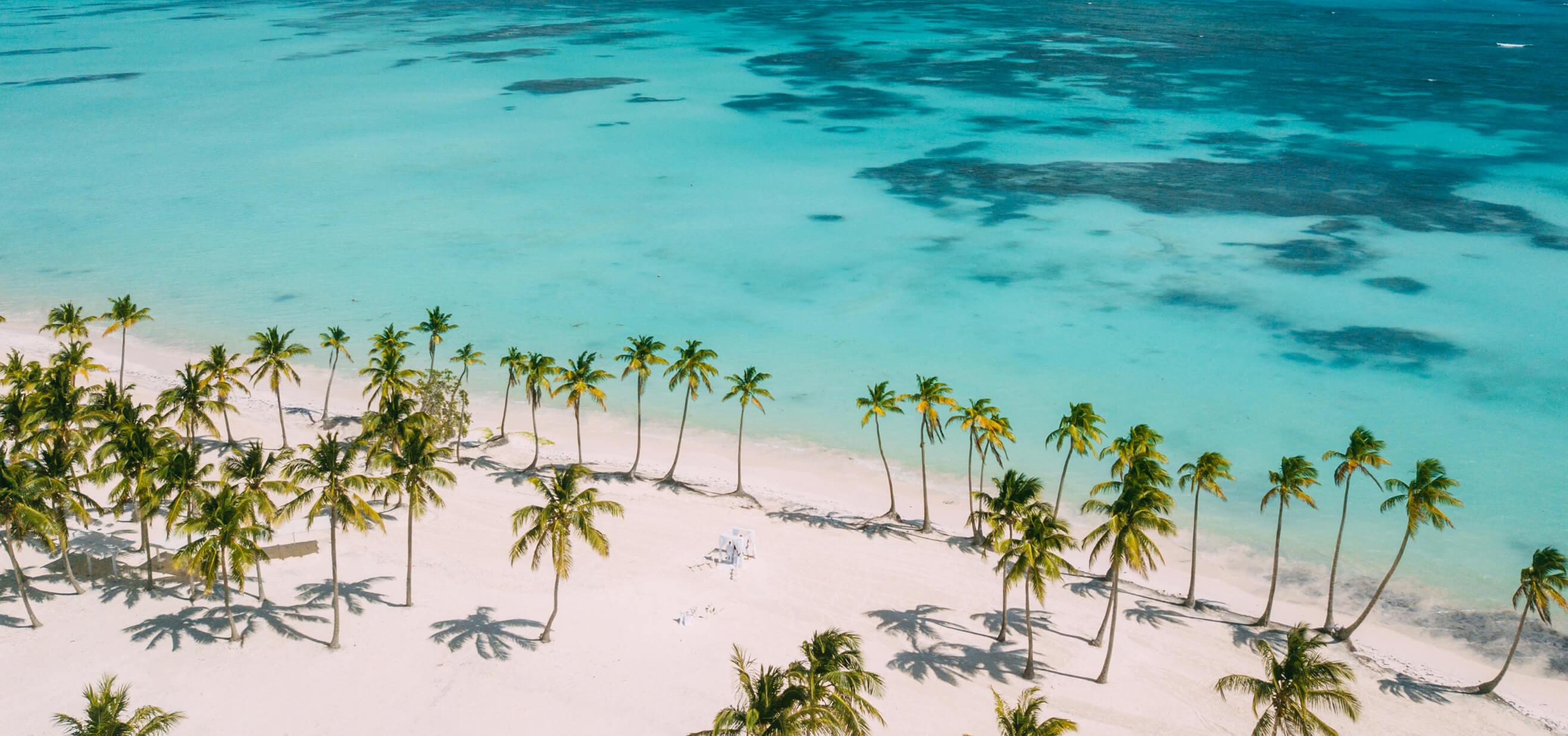 Aerial view of a destination wedding set up on a Dominican Republic beach