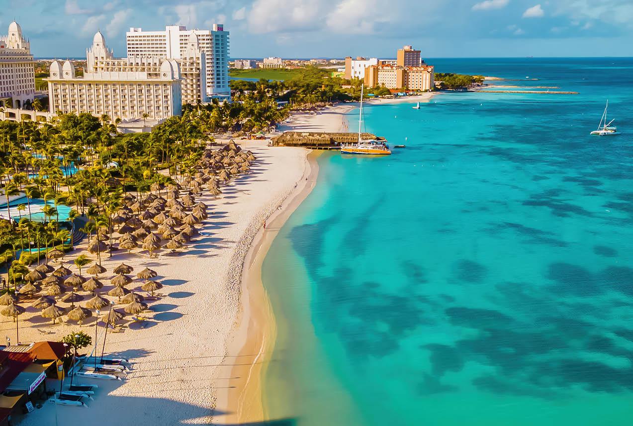 Beachfront resort overlooking turquoise sea in Aruba