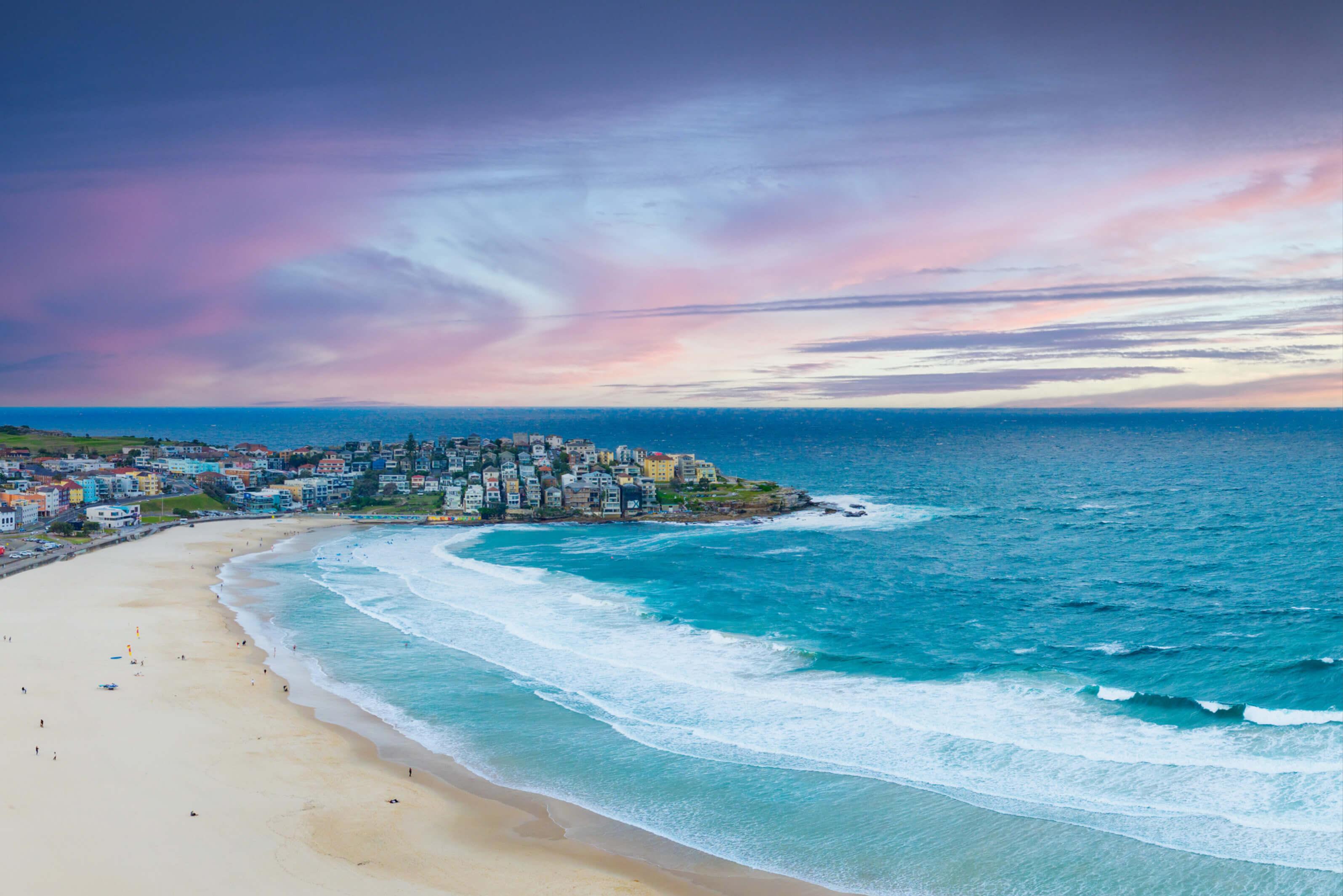 Large beach set beside colorful town in Australia