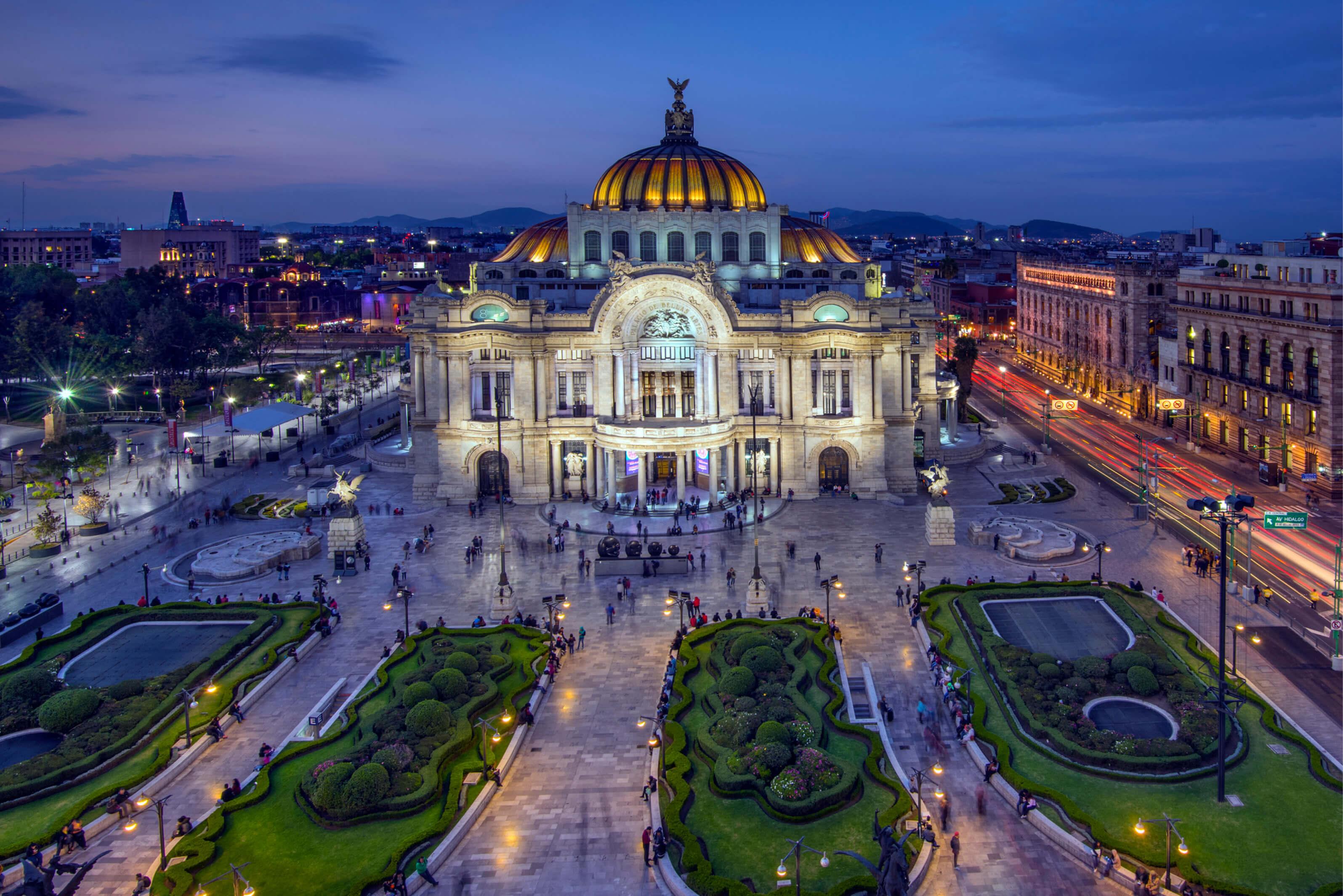 The Palace of Fine Arts in Mexico City, showcasing its grand architecture and vibrant surroundings