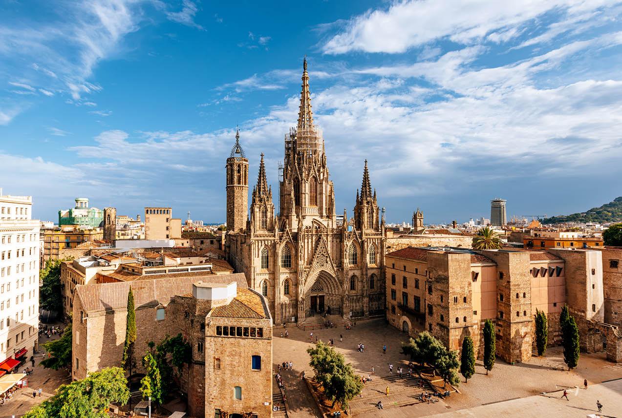 A large, ornate cathedral in Spain, showcasing intricate architecture and towering spires