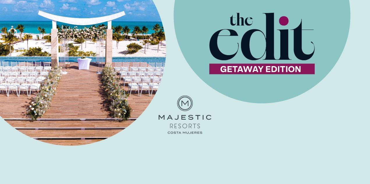Majestic Resorts Costa Mujeres beachfront wedding venue with a ceremony arch, white seating, and ocean views.