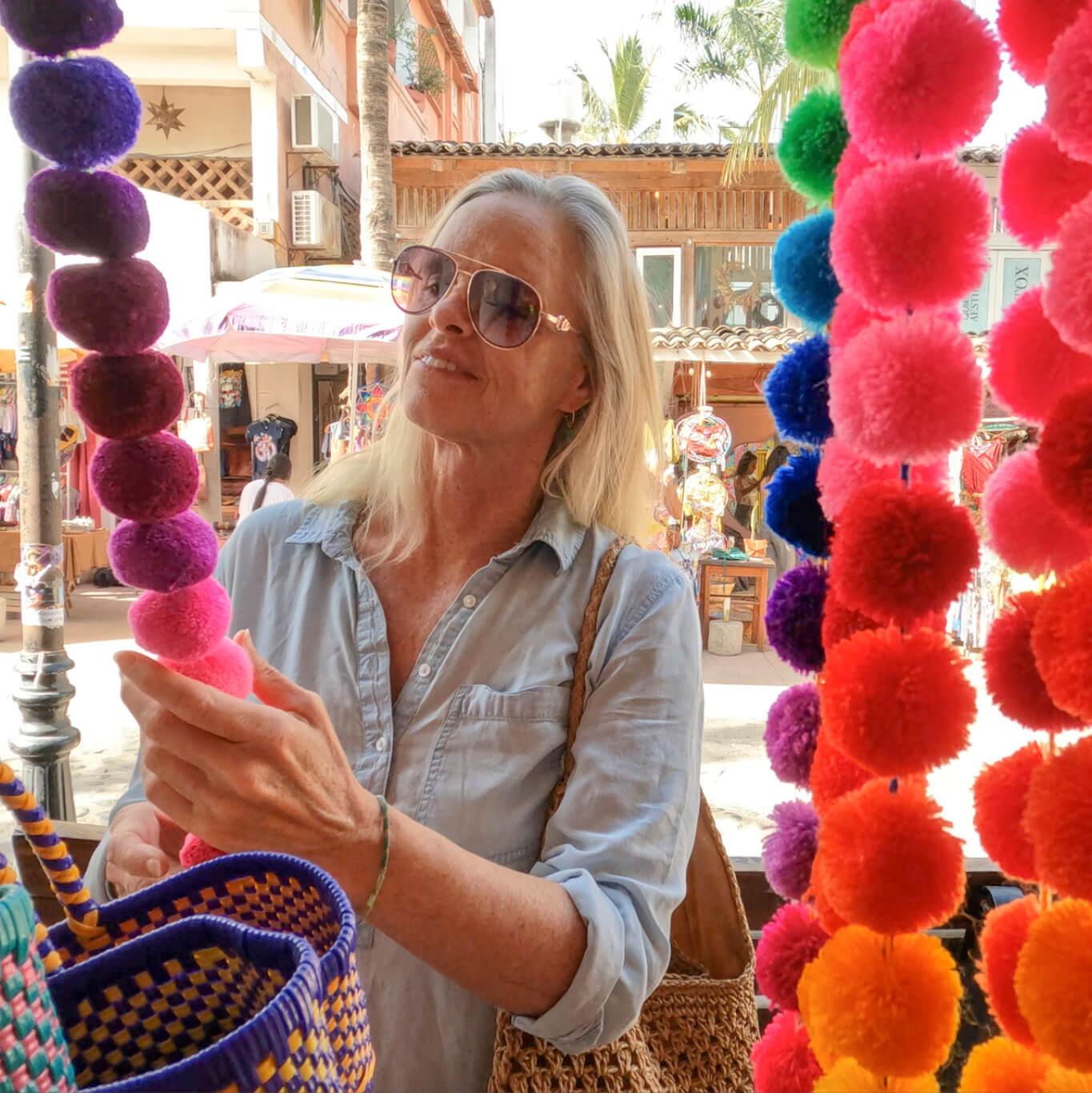 A woman browses at an artisanal market in Sayulita
