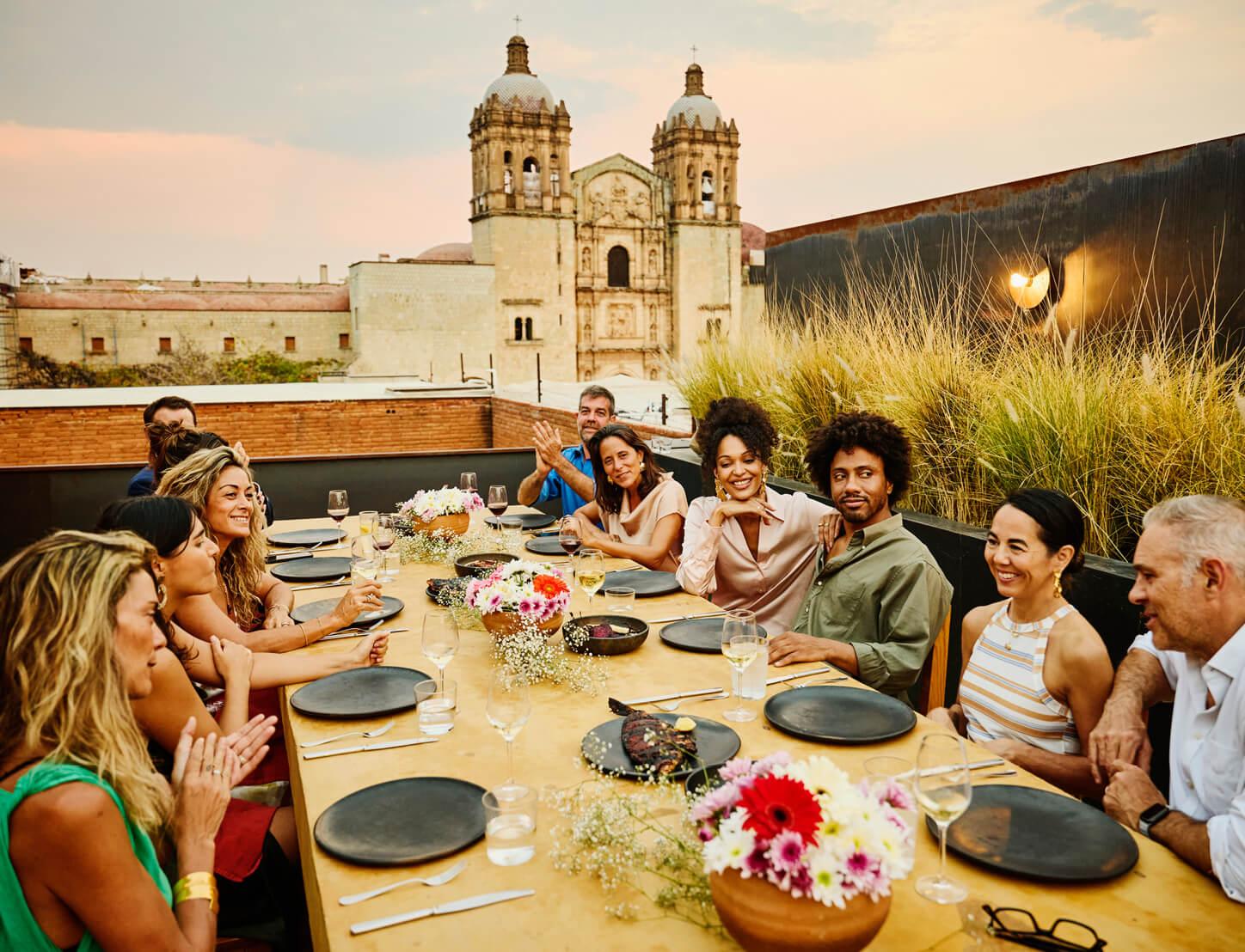 An organization's members enjoy a scenic dinner