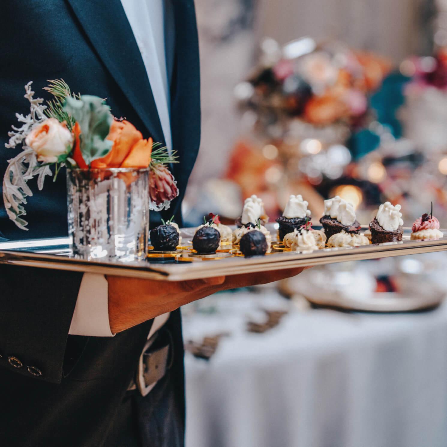 A waiter serves hor d'oeuvrs
