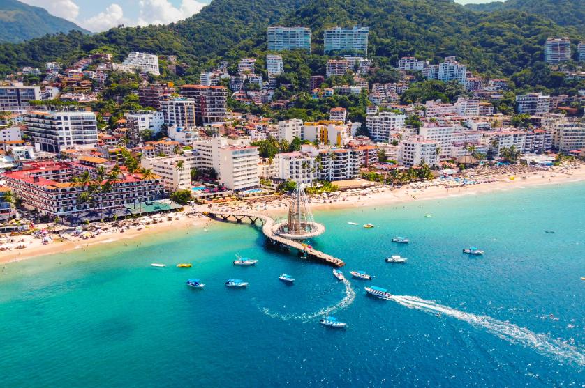 Aerial view of Puerto Vallarta's beach, pier and turquoise coastline
