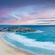 Large beach set beside colorful town in Australia